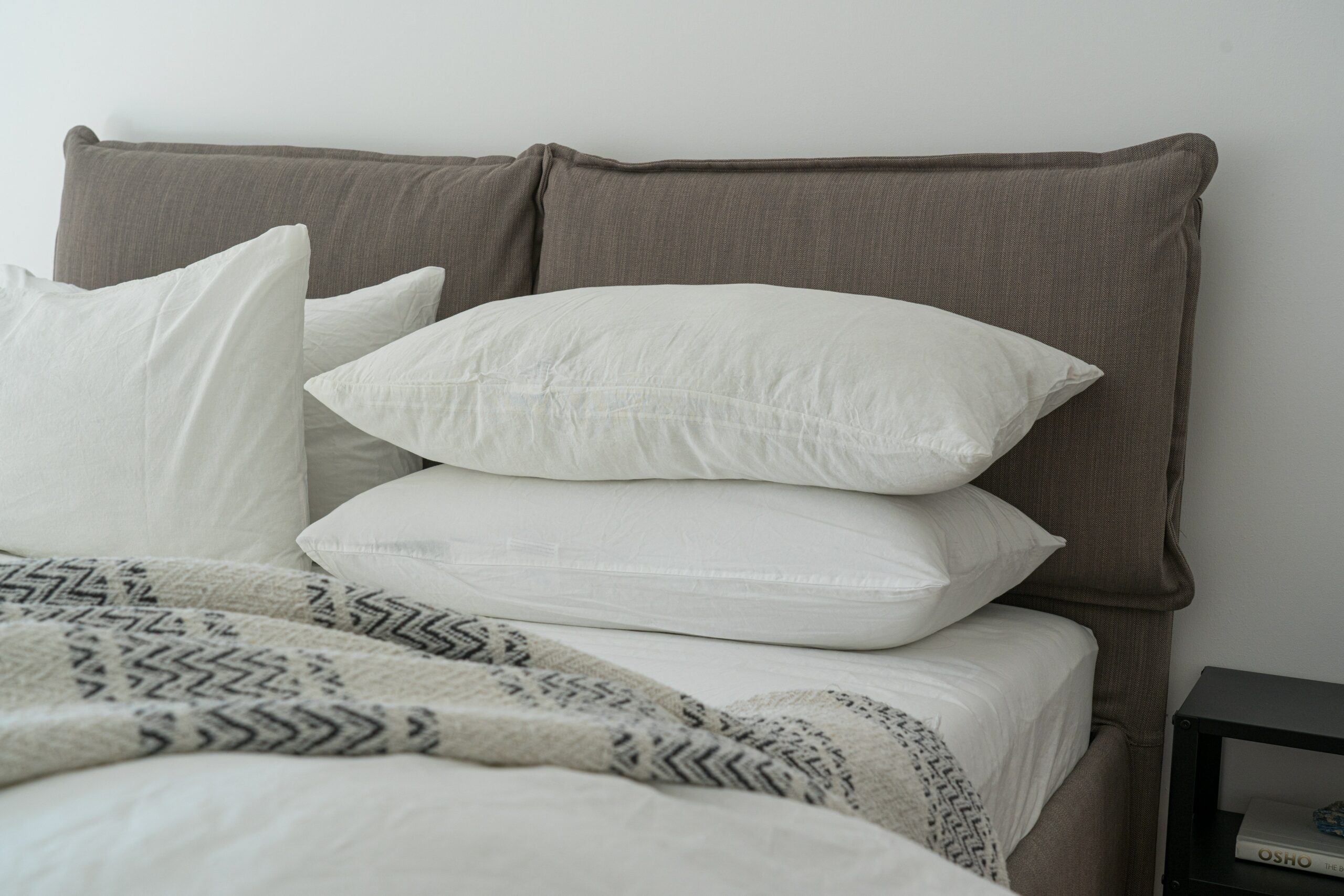 stack-of-pillows-on-mattress